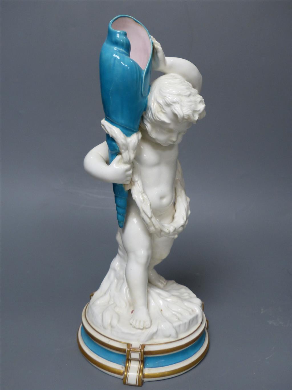 A large late 19th century French porcelain figure of Cupid, an English bone china cherub vase and a similar sweetmeat dish, tallest 3